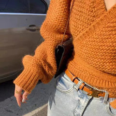 Women's cropped sweater in a soft knit fabric.