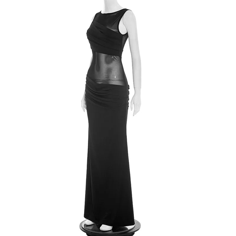 Black evening gown on a mannequin against a white background