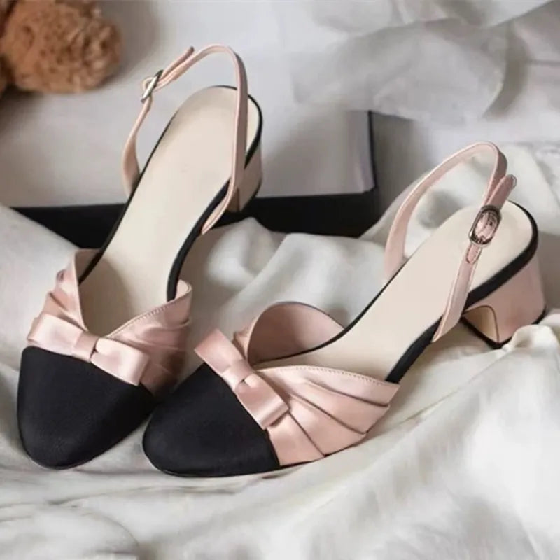 Pink bow slingback mid heel pumps