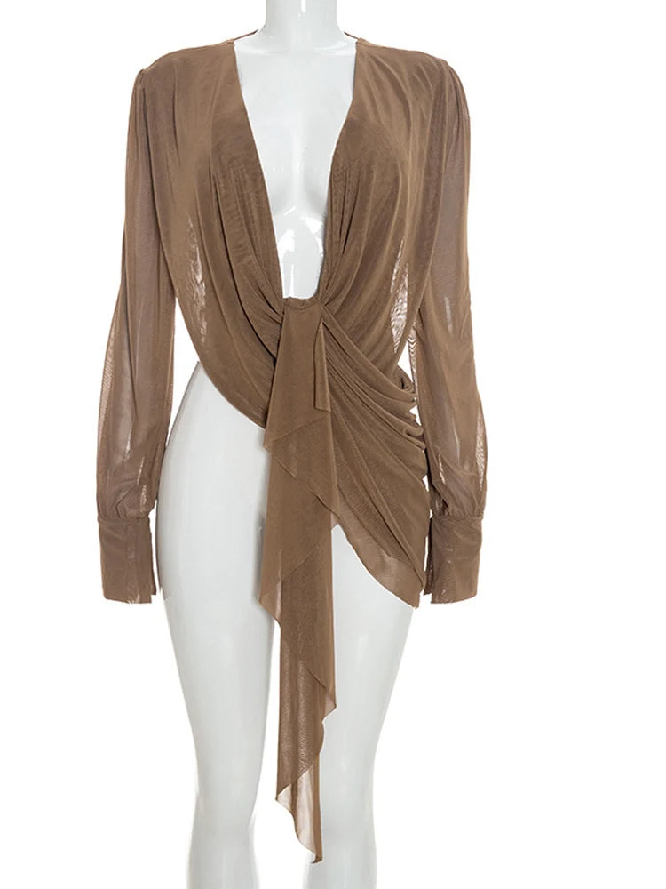 Draped plunge neck long sleeve top on mannequin in brown