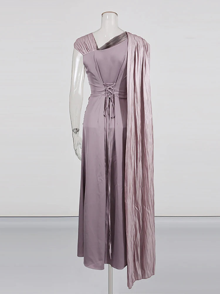 Mauve evening gown on a mannequin against a white background