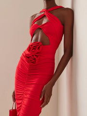 Midi dress with floral appliqué and sculpted waist design
