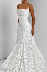 White lace wedding dress on a plain background