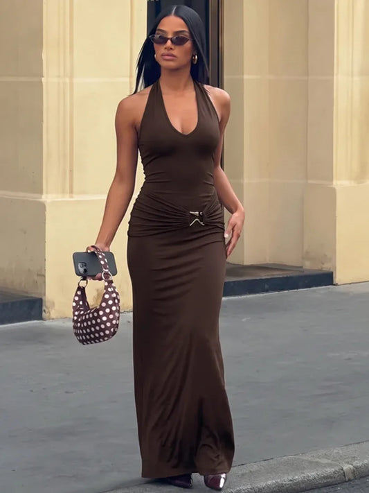 Halter neck maxi dress with deep V-neckline and ruched waist.