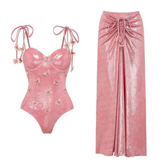 Pink velvet corset-style swimsuit with butterfly details and matching maxi skirt