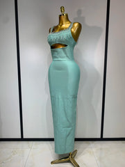 Side view of a form-fitting column dress with beaded embellishments