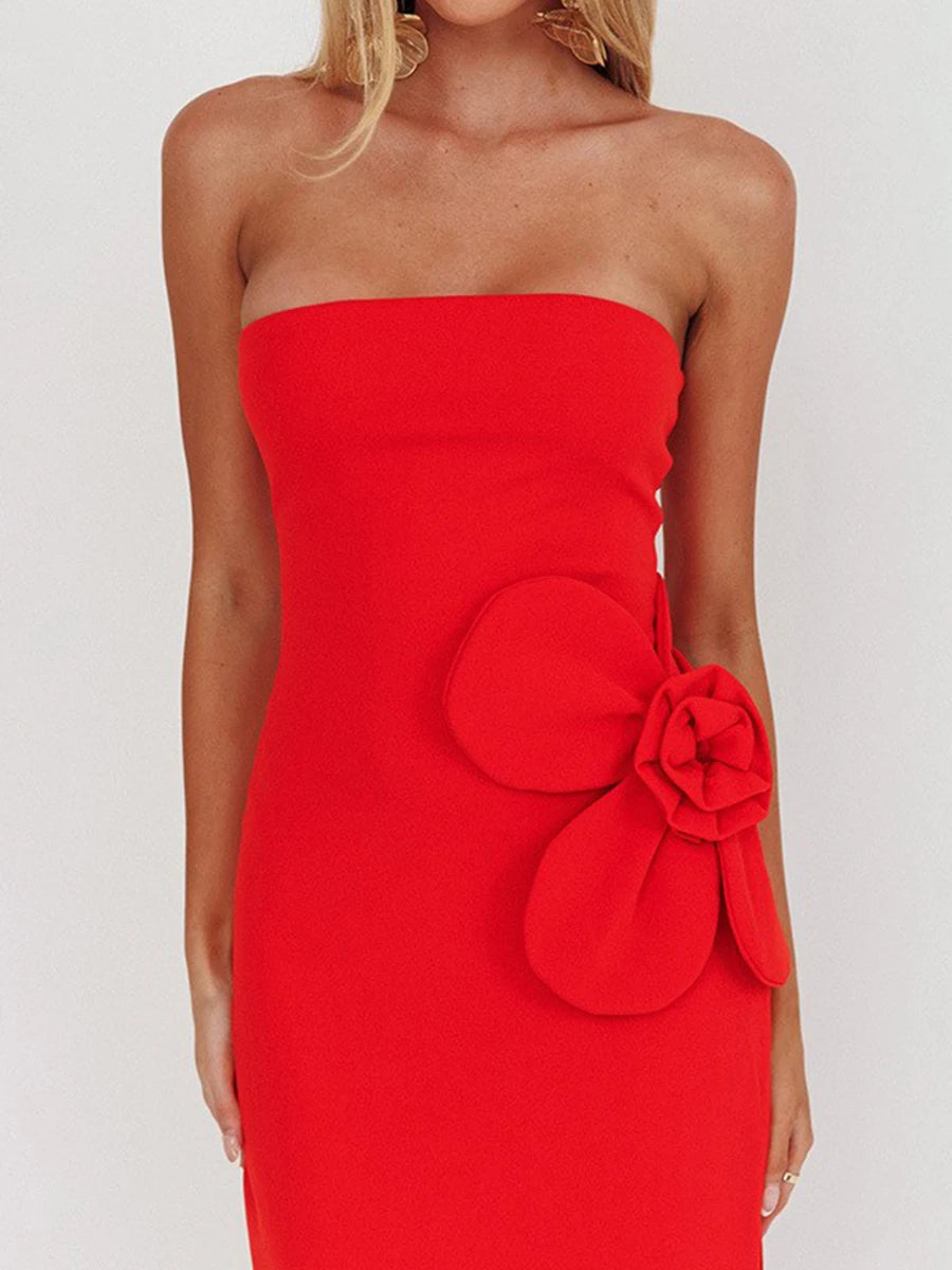 Red strapless dress with a large floral embellishment
