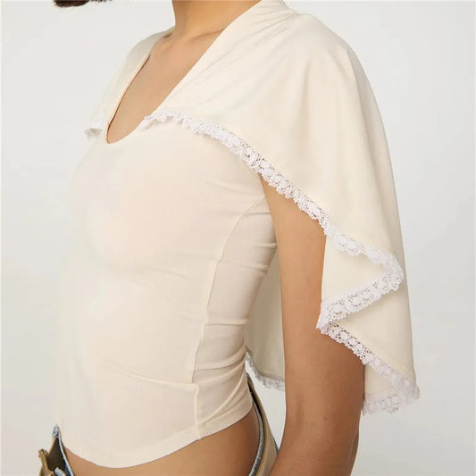 U-neck knit top with white lace trim cape overlay