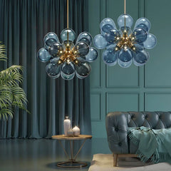 A cluster of  glass bubble LED pendant lights hanging from a ceiling, illuminating a modern living room. Golden Atelier 1