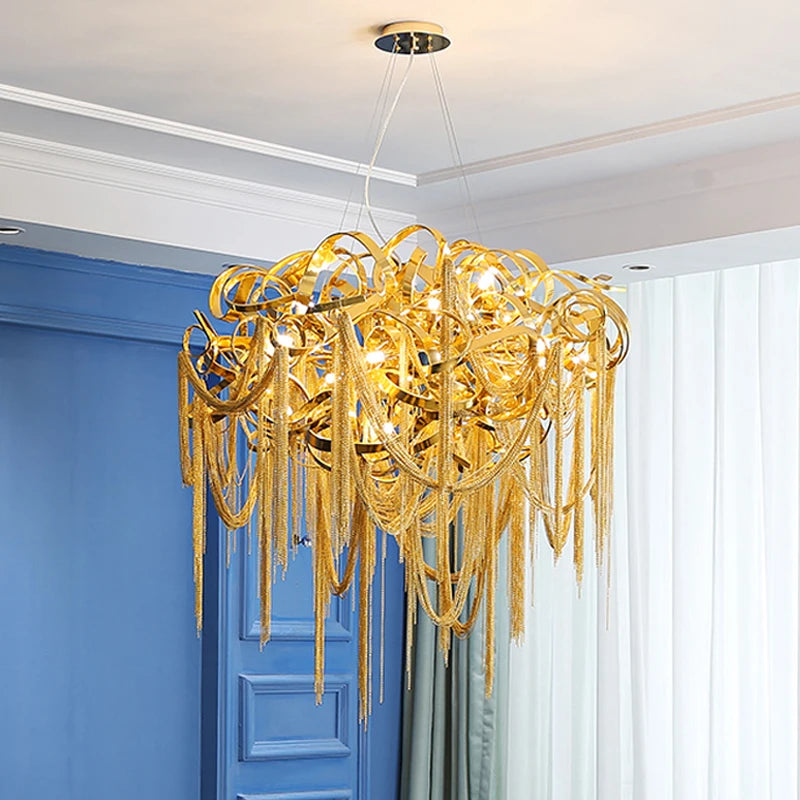 A luxurious French tassel chandelier with a golden finish illuminating a stylish living room. A