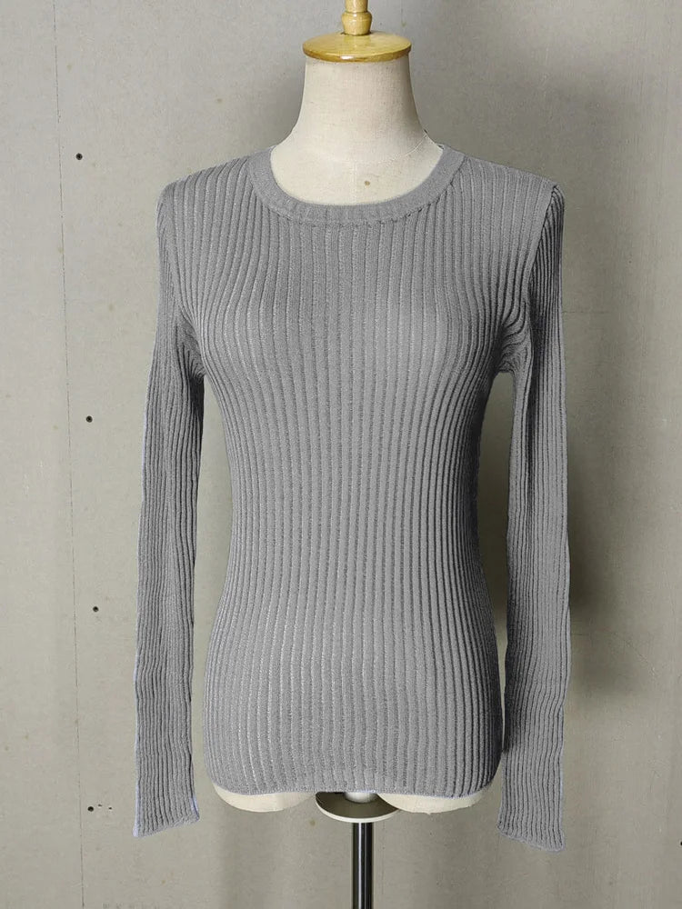 Gray ribbed sweater on a mannequin against a plain background