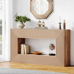 Wooden console table with decorative items in a room with a mirror and window.