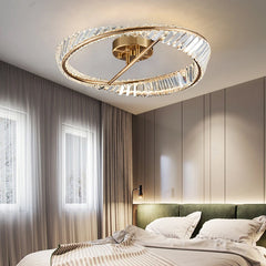 A bedroom with a glamorous crystal chandelier hanging above the bed, creating a relaxing ambiance.