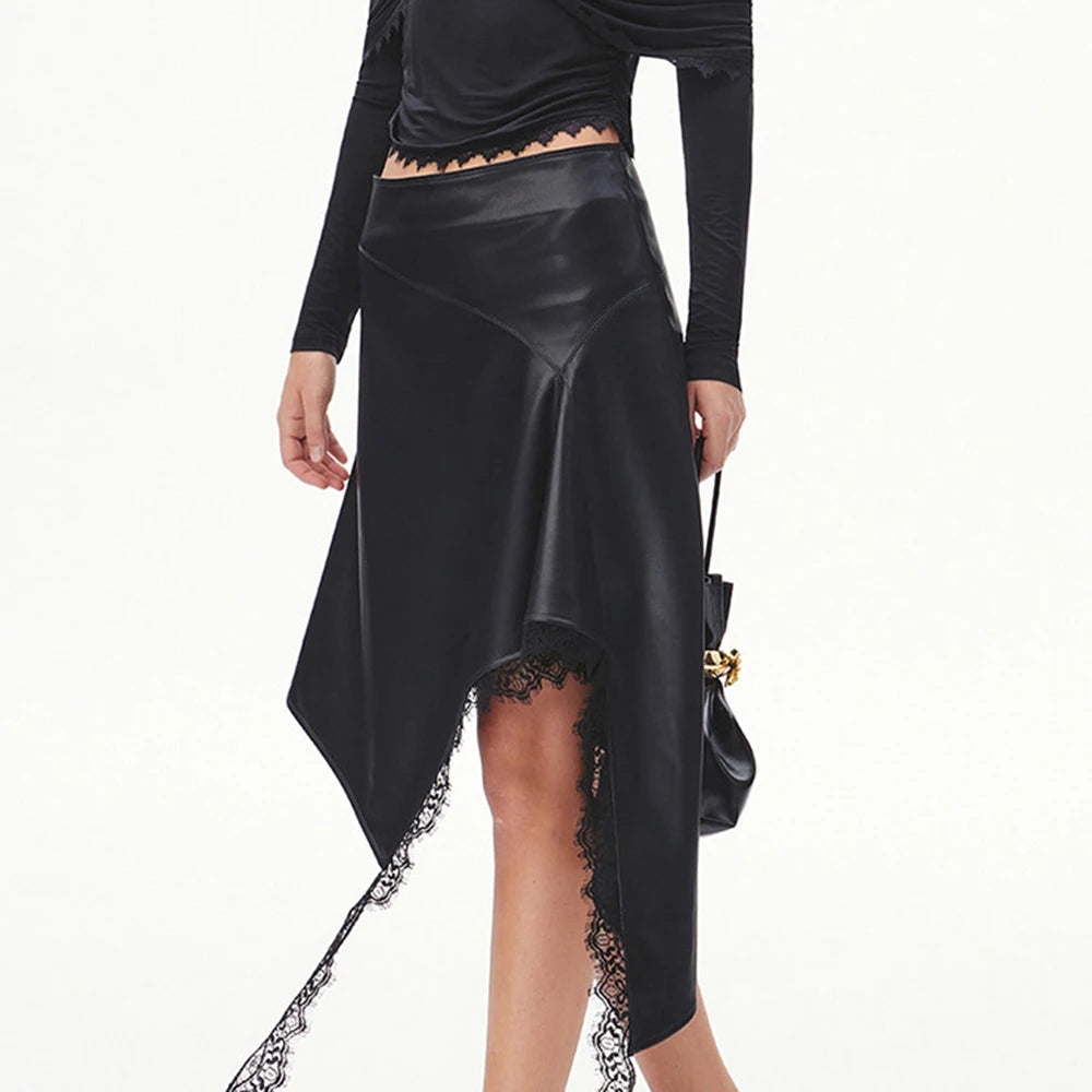 Model wearing an asymmetrical faux leather midi skirt with lace detail