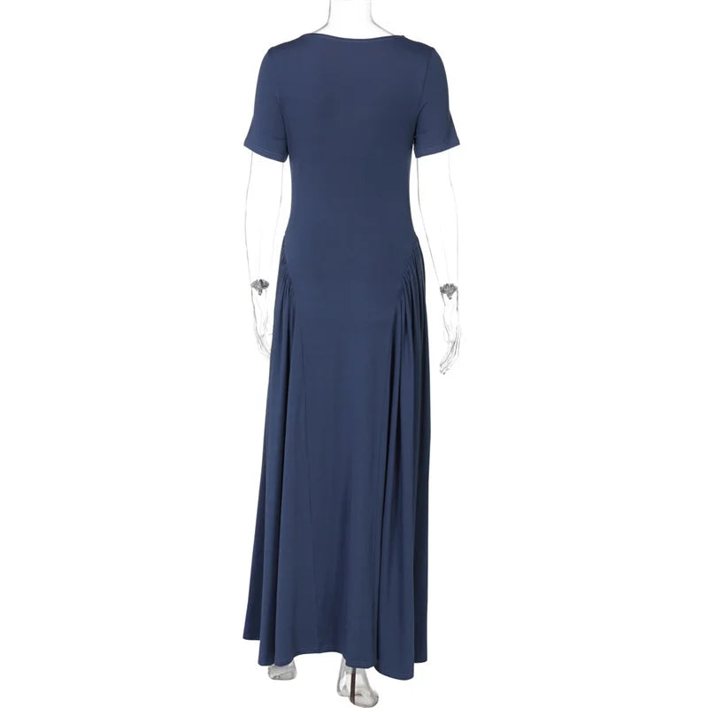 Navy blue dress on a mannequin against a white background