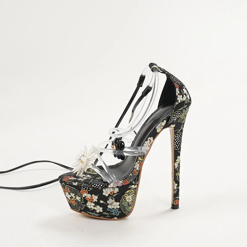 High-heeled shoe with floral pattern and clear strap
