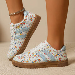 Close-up of floral print lace-up sneakers showcasing the side detail.