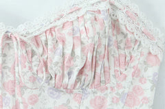 Detailed view of the ruched sweetheart neckline on a midi dress