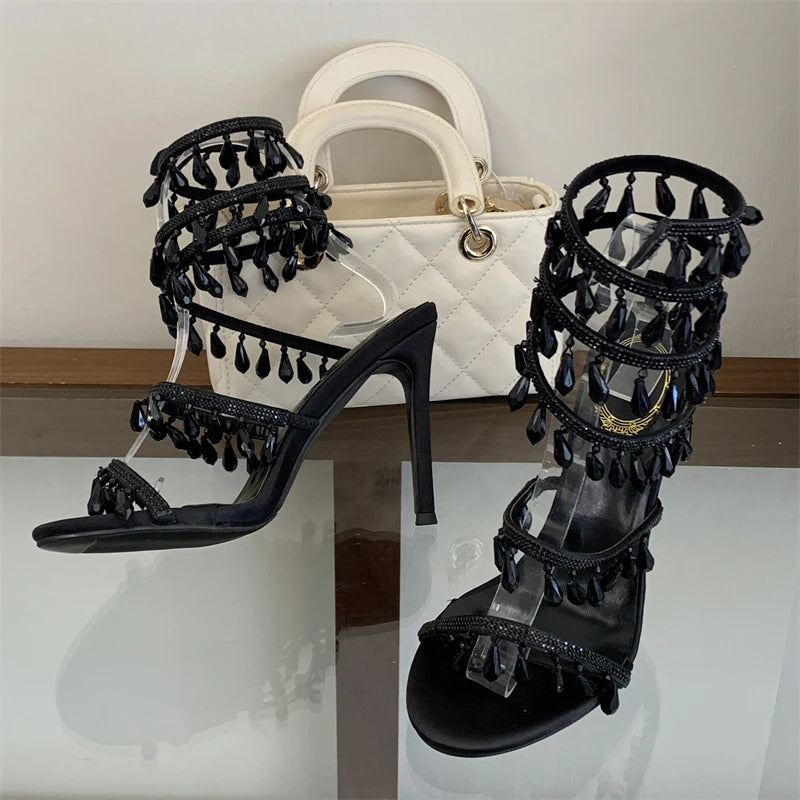 Black crystal ankle strap stiletto heels with handbag