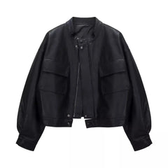 Black cropped faux leather jacket with round neck and dual front pockets.