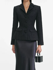 Formal black co-ord set with tweed jacket and satin mermaid silhouette