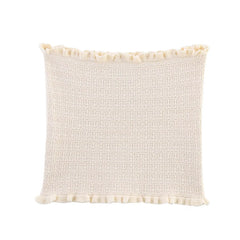 Textured cream pillow with pom-pom trim on a white background