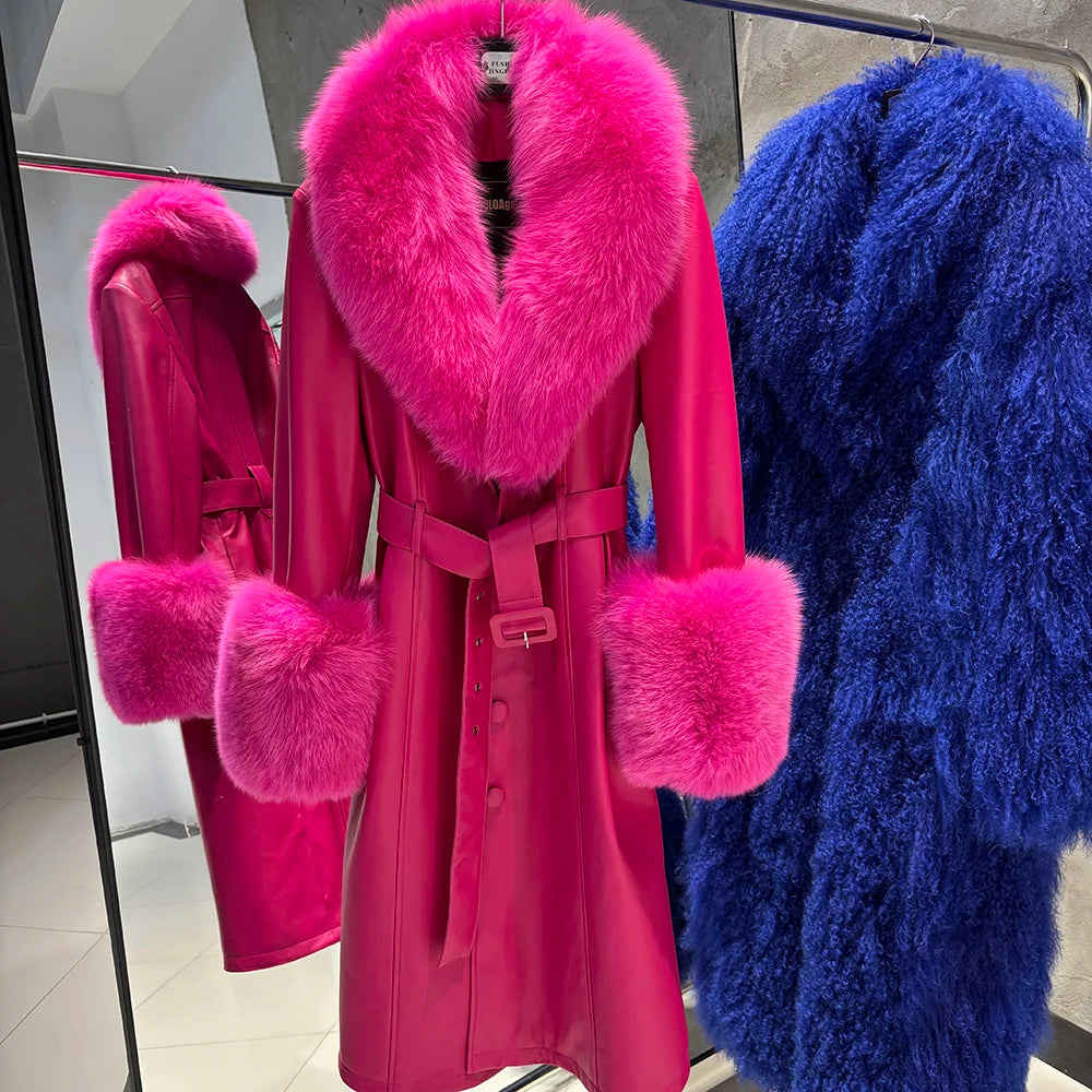Pink coat with fur trim and blue fuzzy garment on a rack.