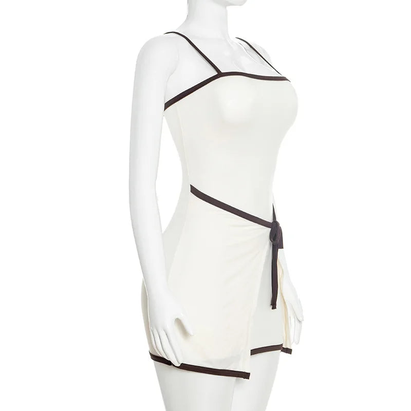 White dress with black accents on a mannequin against a white background