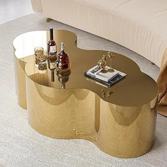 Gold stainless steel cloud shape coffee accent table, minimalist modern style.

