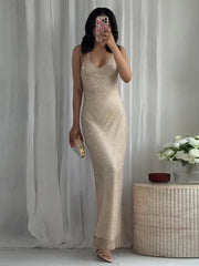 Sleeveless rhinestone deep-V backless maxi dress.

