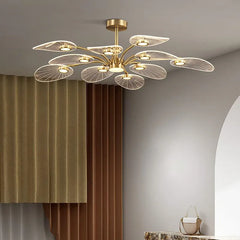  Modern Nordic LED chandelier with copper accents and a lotus leaf design, illuminating a living room. Golden Atelier 2