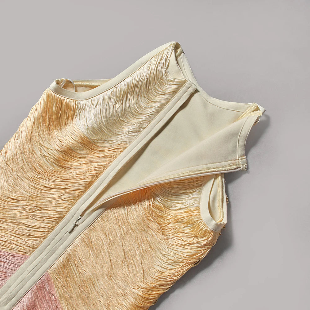 Beige sleeveless top with feather-like texture on a gray background