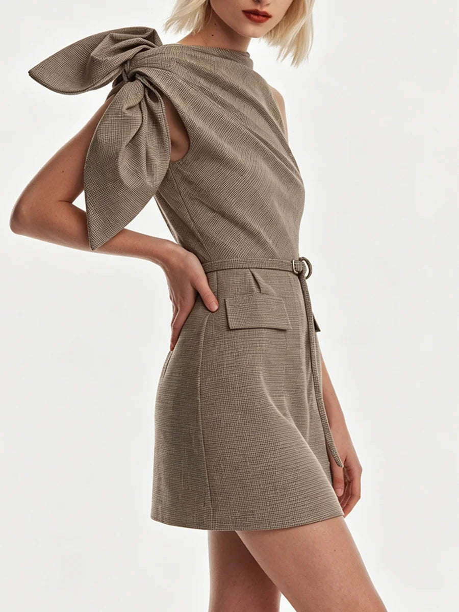 Side profile of asymmetric bow shoulder mini dress