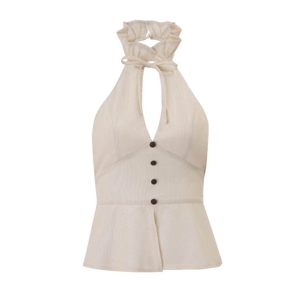 Beige halter top with button details on a white background