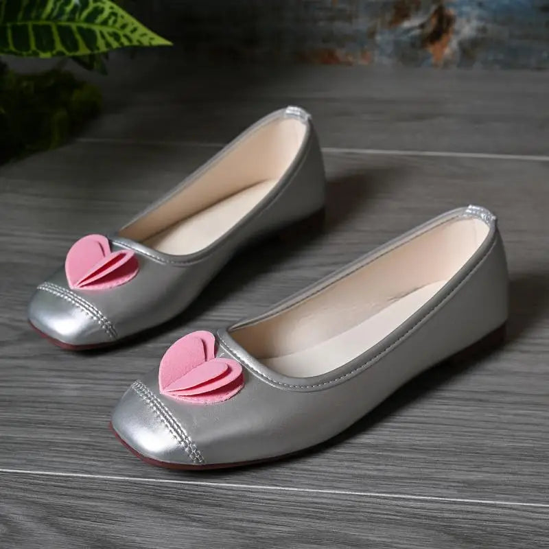 Silver ballet flats with pink heart embellishment