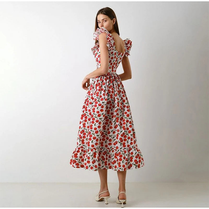 Woman wearing a red floral dress on a white background