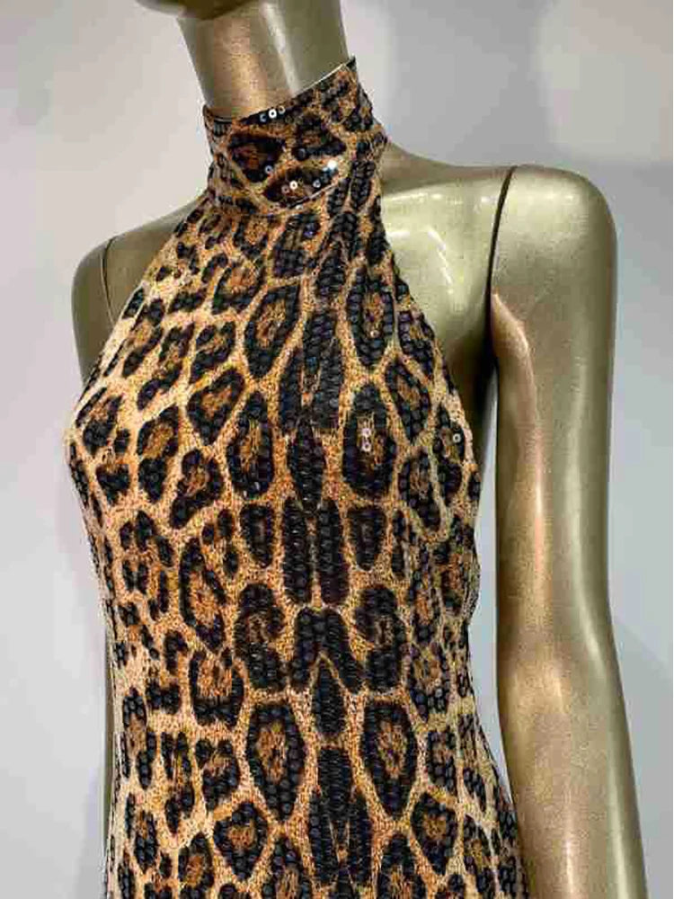 Leopard print dress on a mannequin against a plain background