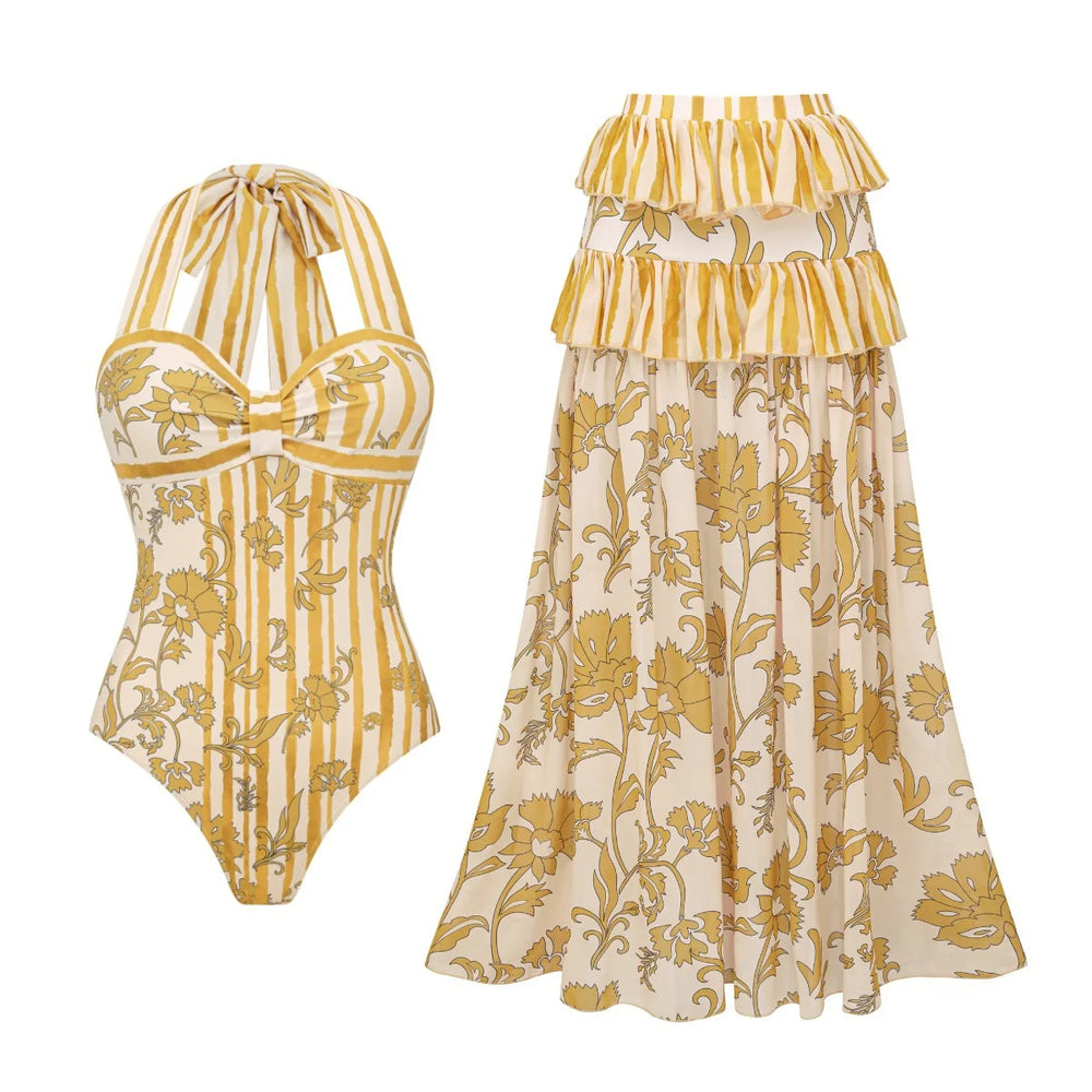 Yellow patterned one-piece swimsuit and tiered skirt