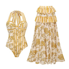 Yellow patterned one-piece swimsuit and tiered skirt