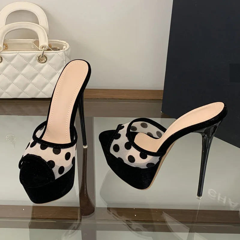 Pair of black polka dot mesh stiletto heels