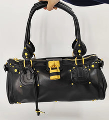 Black studded lock top handle bag