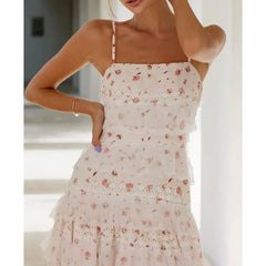 Woman wearing a floral dress with a blurred indoor background