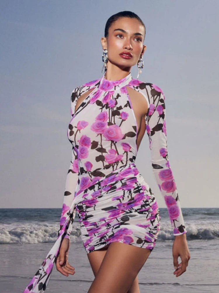 Woman wearing a floral dress on a beach