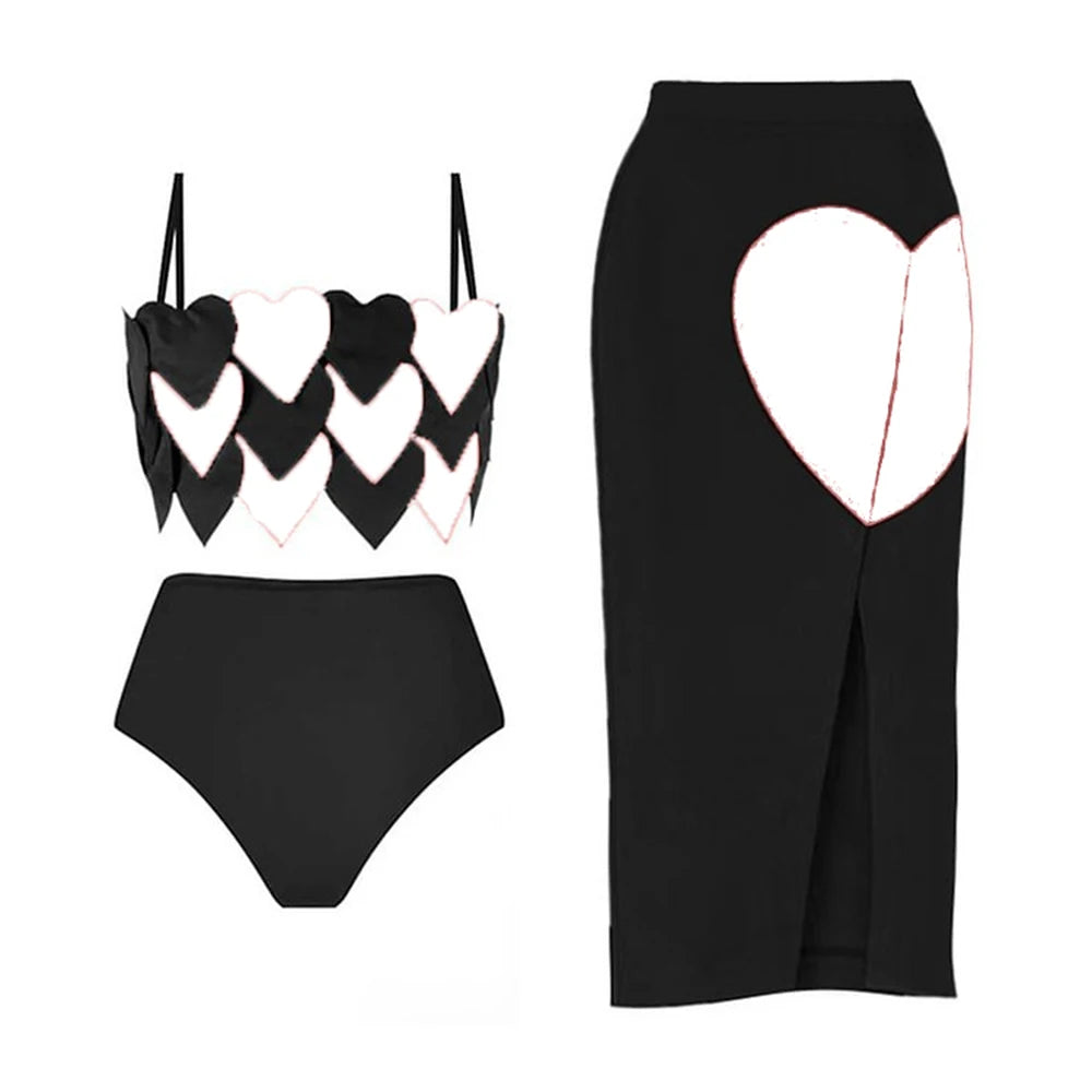 Black two-piece swimwear set with white heart print details and a matching high-waisted bottom.