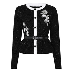 Black sequined embroidered peplum knit cardigan with a white trim and belt.