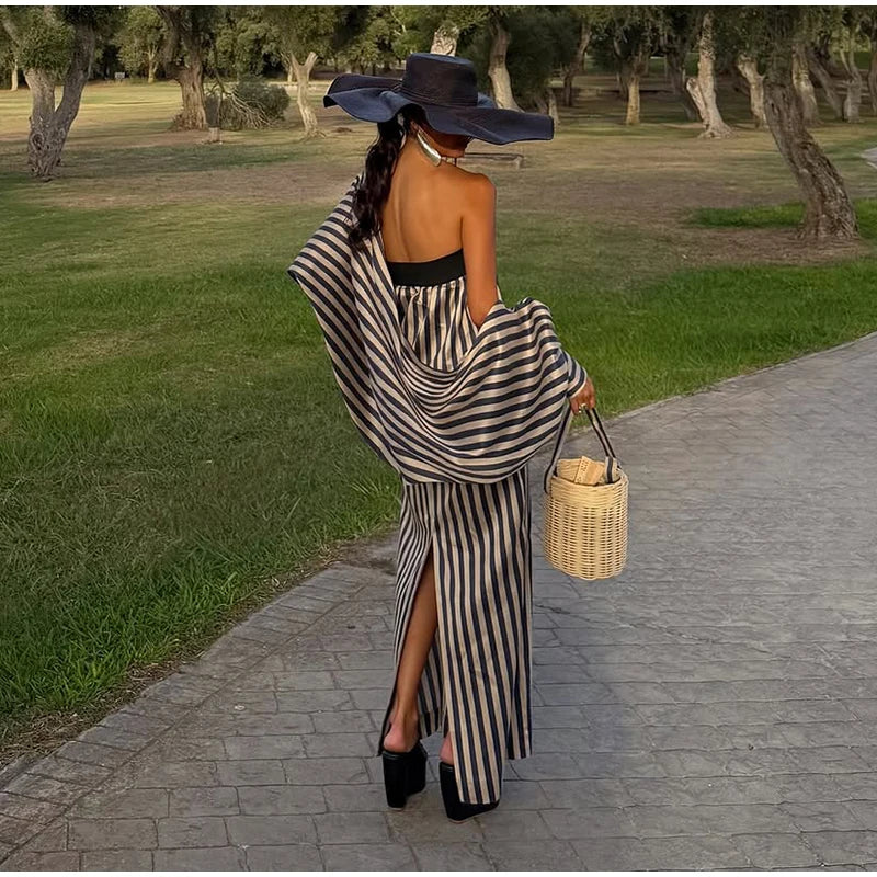 Back view of strapless stripe maxi dress with side slit