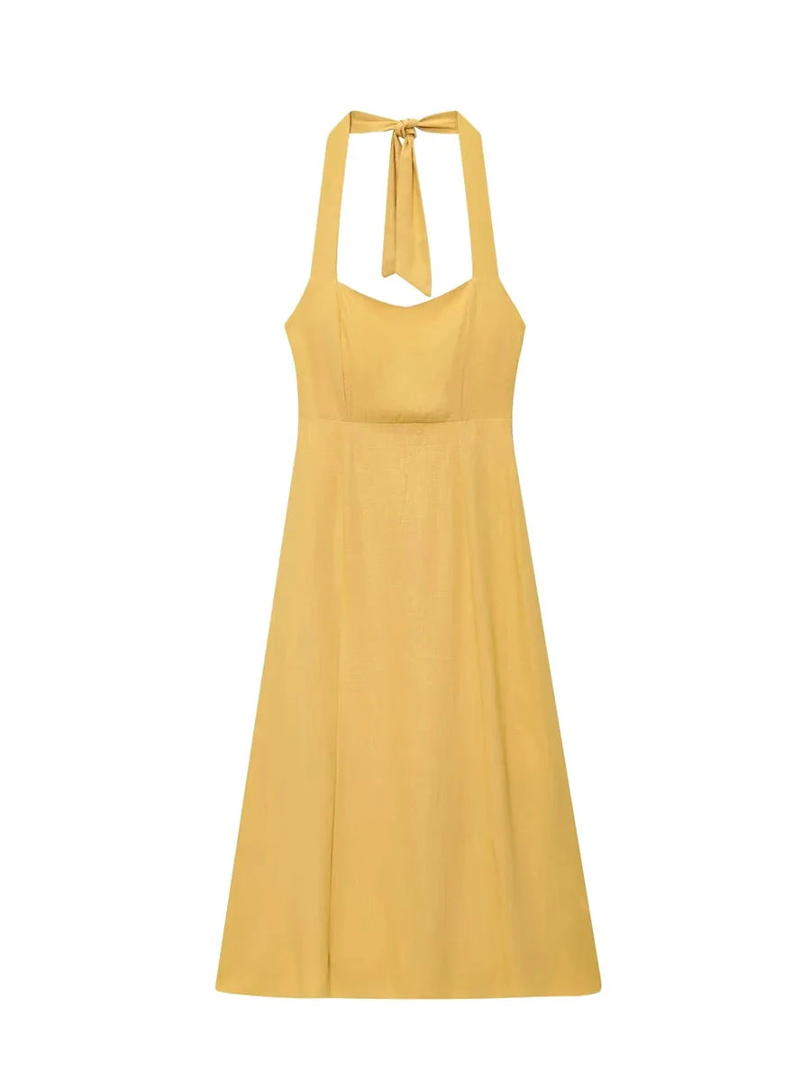 Yellow dress with halter neck on a white background