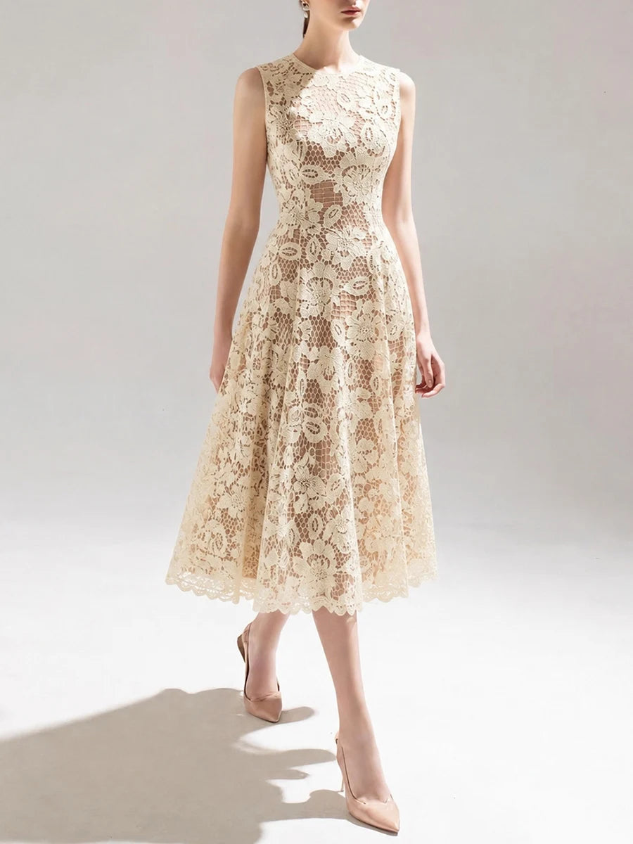 Model wearing a light apricot lace midi dress from the front
