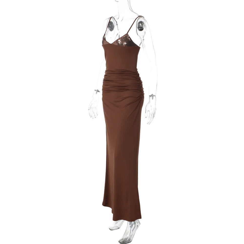 Brown evening gown on a mannequin against a white background