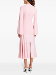 pink long-sleeve midi dress highlighting the clean neckline and flowing skirt silhouette on model